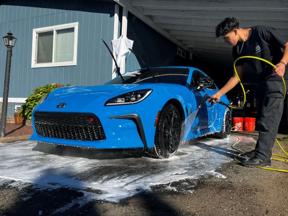 Image of rinsing a vehicle after a wash